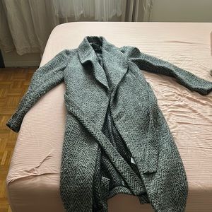 This grey coat is the perfect addition to any wardrobe.